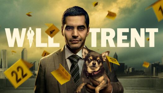 Will Trent key art featuring Ramón Rodríguez as Will Trent holding his dog, Betty.