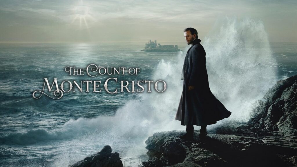 Man in a dark cloak stands on jagged rocks as massive waves crash behind him, with 'The Count of Monte Cristo' text across the sea.