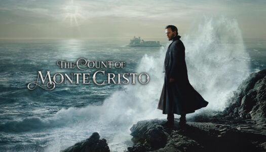 Man in a dark cloak stands on jagged rocks as massive waves crash behind him, with 'The Count of Monte Cristo' text across the sea.