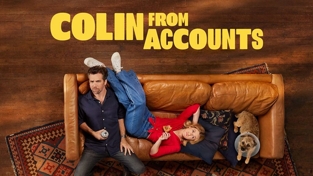 Poster for Colin from Accounts showing a man on the left sitting on a rug with a beer, a woman in red lounging on a brown couch, and a dog wearing an Elizabethan cone on the right.