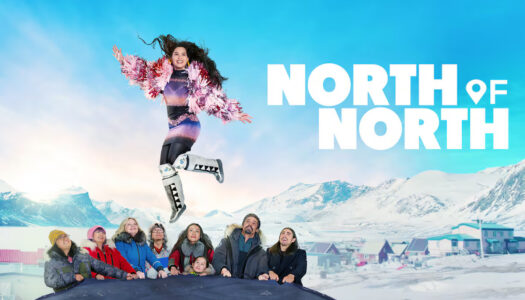 Promotional banner showing a woman in a colorful outfit leaping above a cheering group against a snowy mountain backdrop with the title 'NORTH OF NORTH'.
