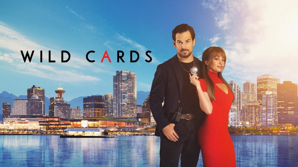Poster for Wild Cards featuring a man in a black suit and a woman in a red dress standing by a city skyline.