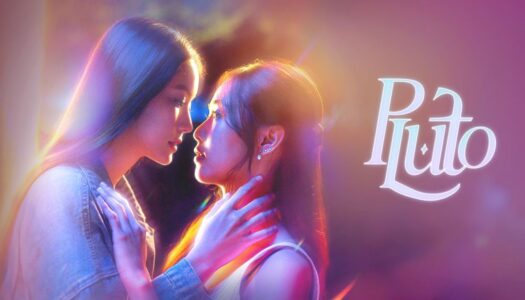 Two young women gaze into each other's eyes, hands gently on each other, under colorful neon lighting with a 'Puto' logo to the right.